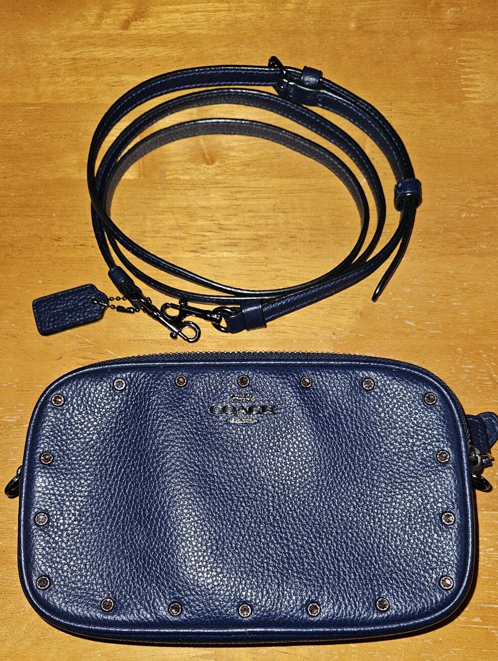 Coach Pebbled Leather Navy Crossbody Bag with Stud Accents